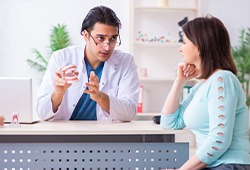 Dentist discussing the status of a patient’s smile