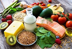 Variety of healthy foods on wooden tabletop