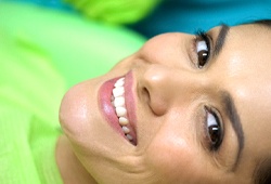 Woman smiling in dentist’s chair