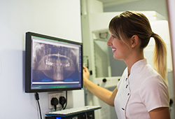 dentist taking X-rays of a patient’s mouth and jaw