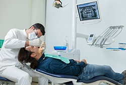 dentist examining a patient’s mouth 