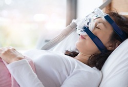 Woman wearing CPAP mask