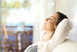 woman relaxing and lying back in the dentist chair