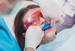 Patient receiving fluoride treatment