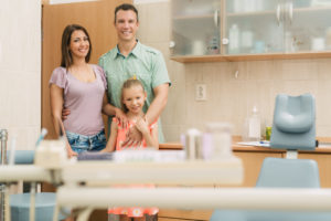 Young family visiting office of family dentist in Stephens City 