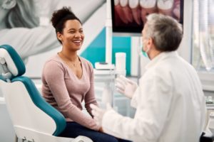 woman talking to dentist in Stephens City