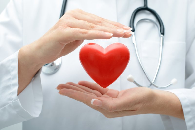 doctor holding heart