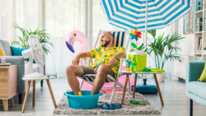 Man relaxing on a beach chair at home 