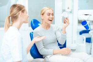 Woman smiling at her cosmetic dental treatment results